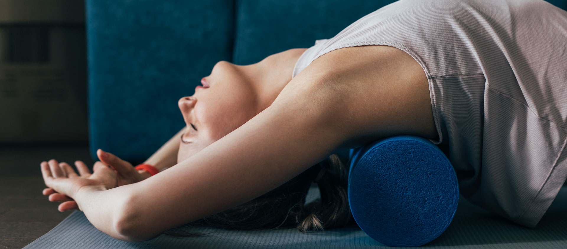 woman stretching on foam roller