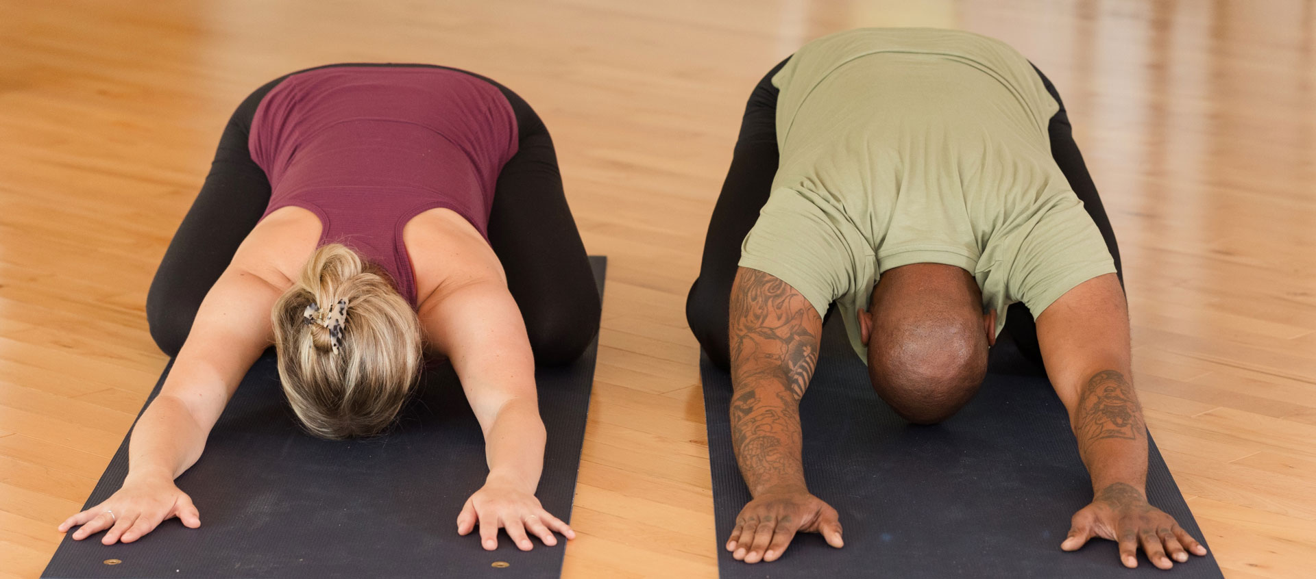 two people in child's pose