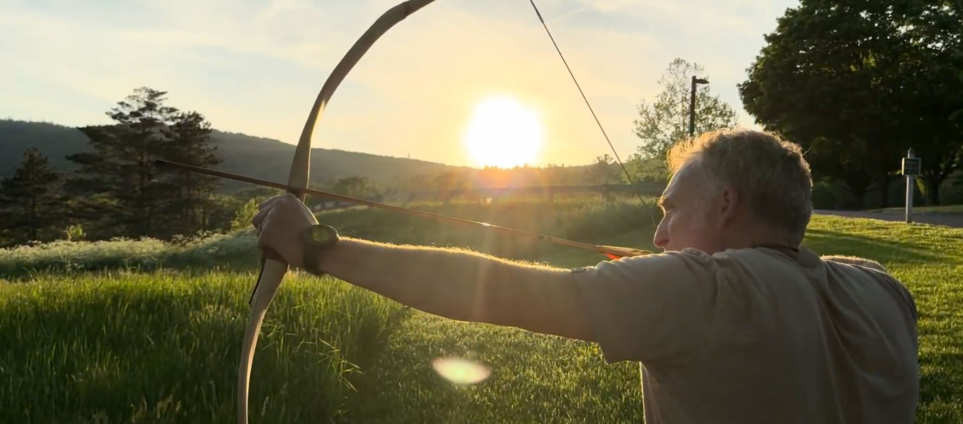 man practicing archery