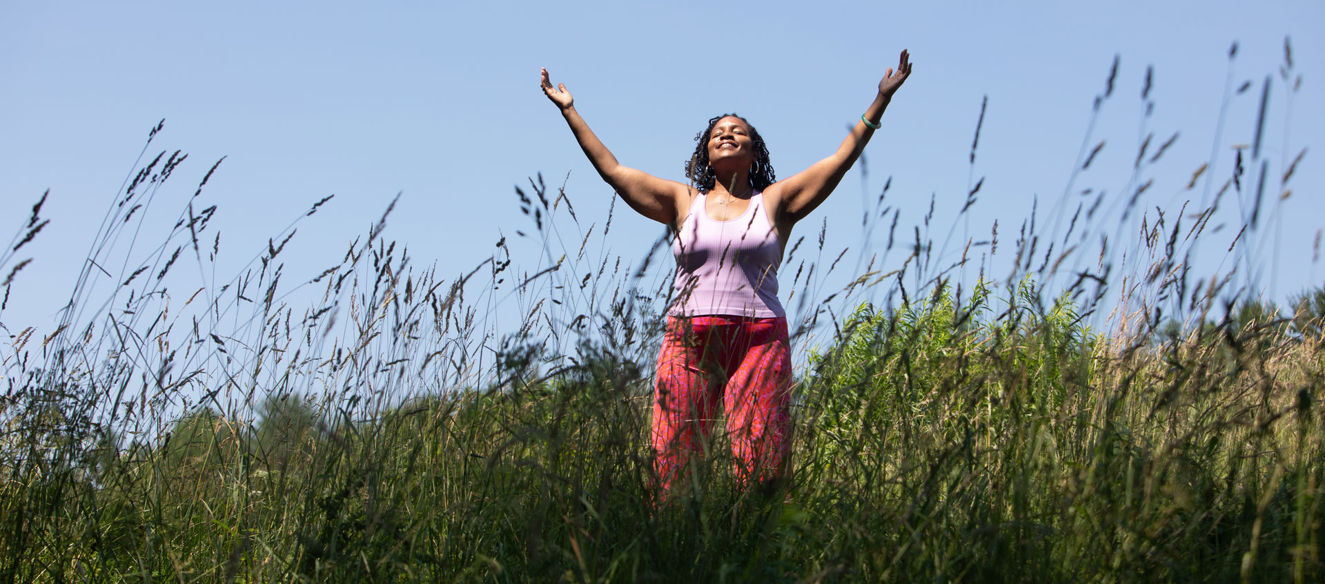 woman with arms outstretched