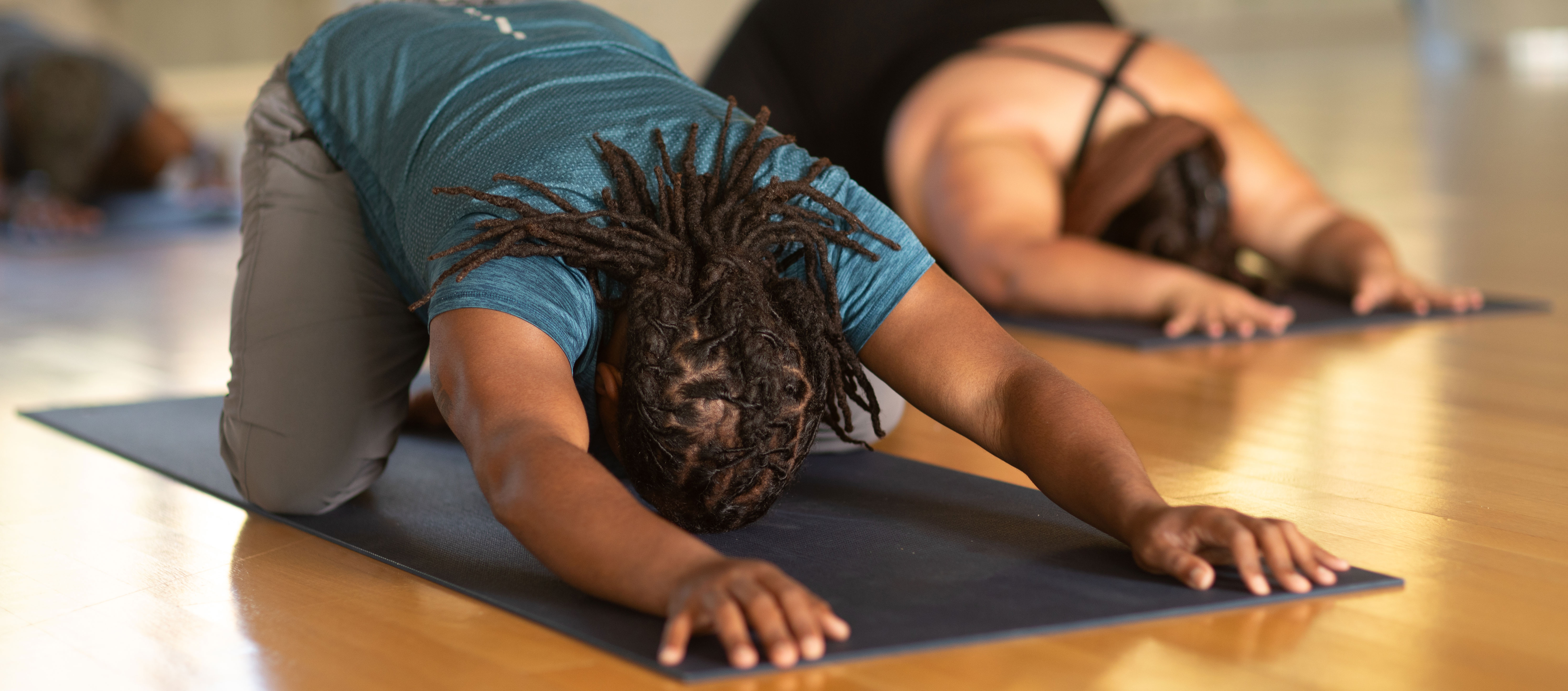 students in child's pose