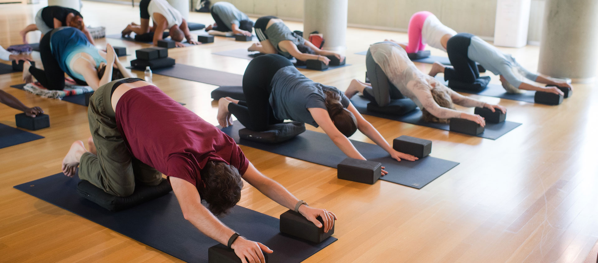 yoga students in child's pose